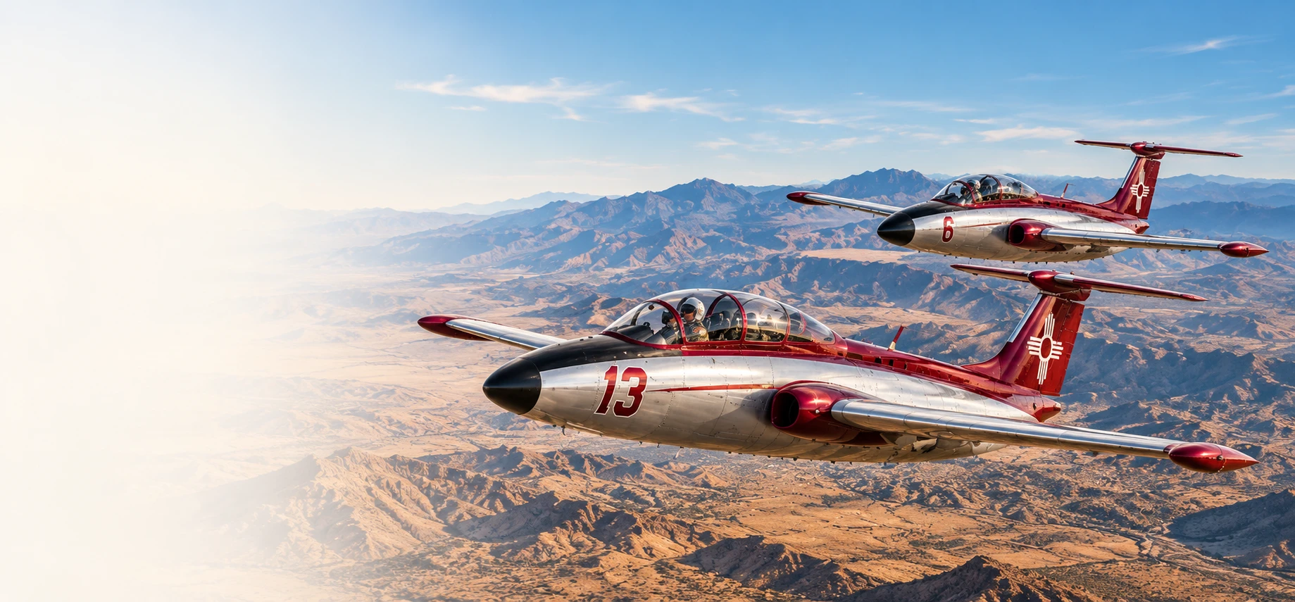 Illustration of Lucky 13 and a second Team Zia L-29 flying over New Mexico mountains.